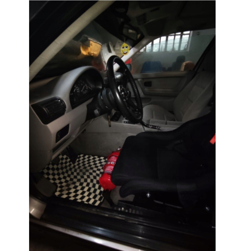 Fire extinguisher mounting bracket for BMW